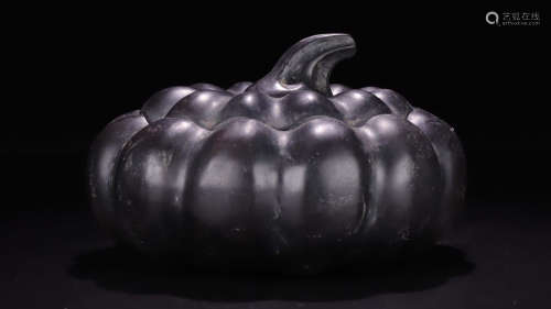 A STONE CARVED PUMPKIN SHAPED BOX