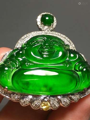 A GREEN JADEITE CARVED BUDDHA PENDANT, TYPE A