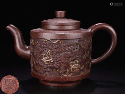 A ZISHA CARVED LION PATTERN TEA POT