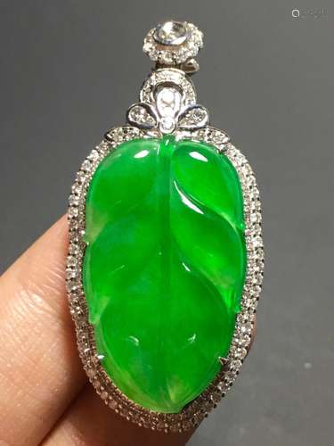 A GREEN JADEITE CARVED LEAF PENDANT, TYPE A