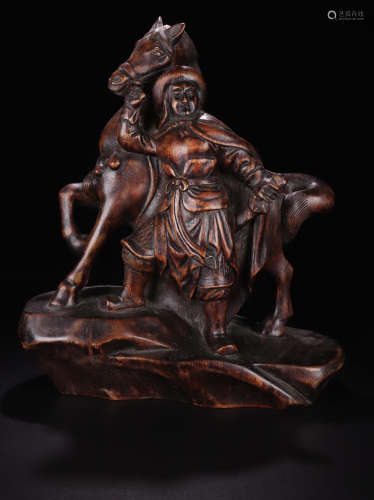 A CHENXIANG WOOD CARVED FIGURE SHAPED PENDANT