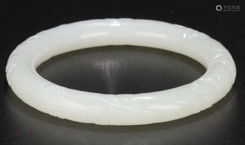 A HETIAN JADE CARVED BANGLE