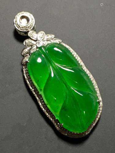 A GREEN JADEITE CARVED LEAF PENDANT, TYPE A