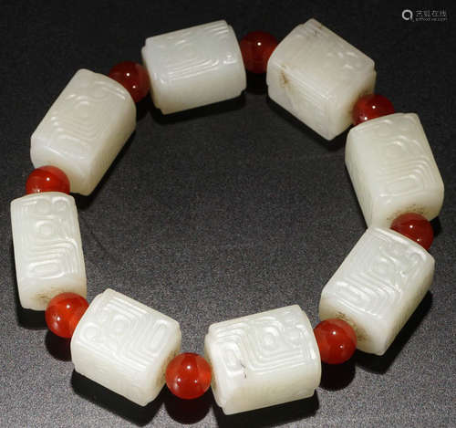 A HETIAN JADE CARVED SQUARE BEADS STRING BRACELET