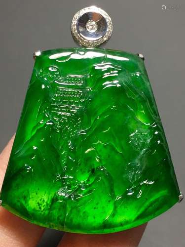 A GREEN JADEITE CARVED LANDSCAPE PENDANT, TYPE A