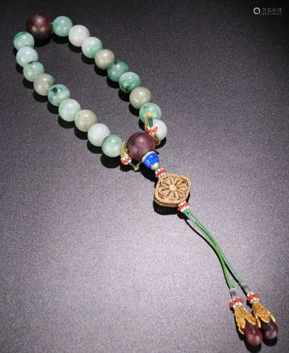 A JADEITE CARVED BEADS STRING BRACELET