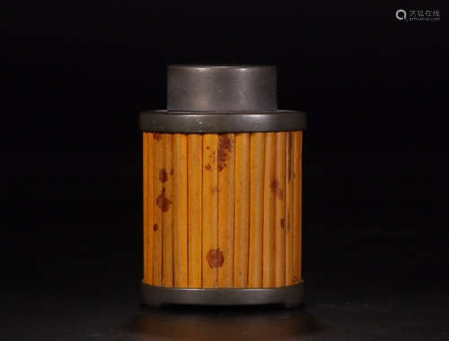 A CYLINDER TEA LEAF JAR MADE OF TIN AND BAMBOO