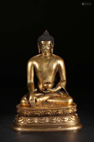 A GILT BRONZE SITTING BUDDHA ORNAMENT