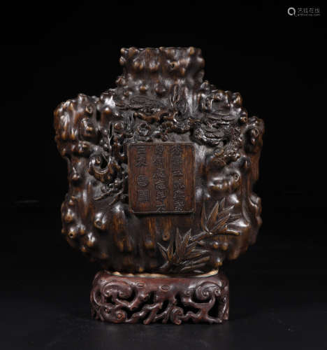 A CHENXIANG WOOD VASE WITH PLUM TREE PATTERNS AND LID