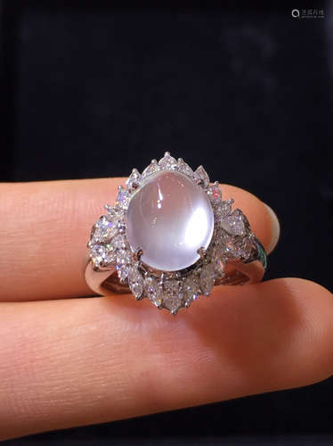 AN ICY JADEITE RING WRAPPED IN DIAMONDS