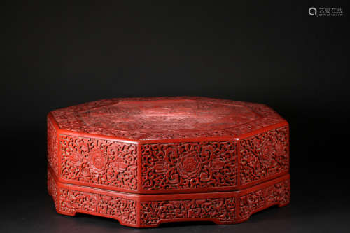 A RED LACQUER BOX WITH FIGURE CARVING