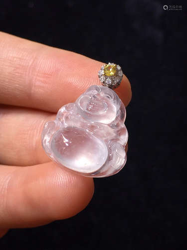 AN ICY BUDDHA SHAPED PENDANT