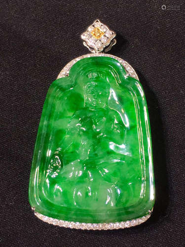 A GREEN JADEITE PENDANT CARVED IN BUDDHA