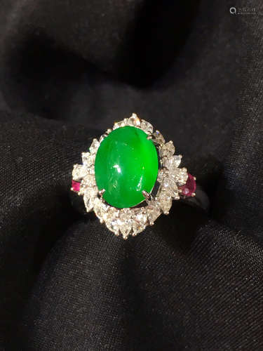 A GREEN JADEITE RING WRAPPED WITH DIAMONDS