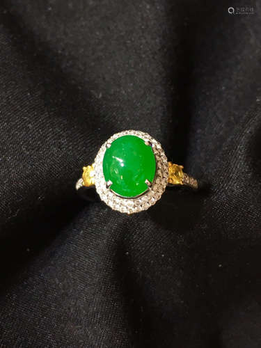 A GREEN JADEITE RING WRAPPED WITH DIAMONDS