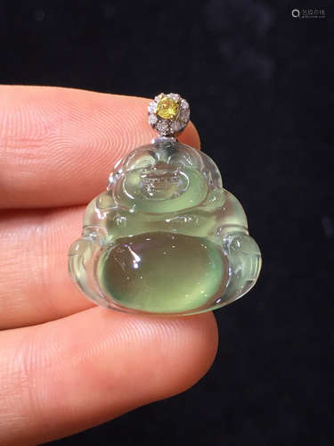 AN ICY BUDDHA SHAPED PENDANT