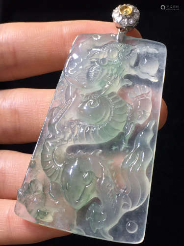 AN ICY JADEITE PENDANT CARVED IN DRAGON