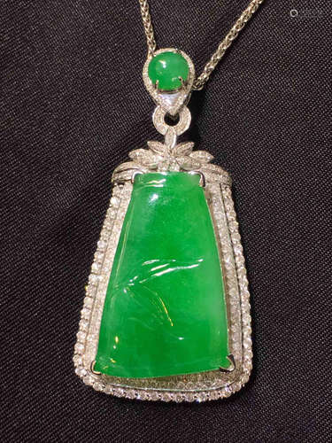 A GREEN JADEITE PENDANT CARVED IN BAMBOO WITH NECKLACE