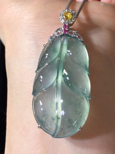 AN ICY LEAF SHAPED JADEITE PENDANT WITH NECKLACE