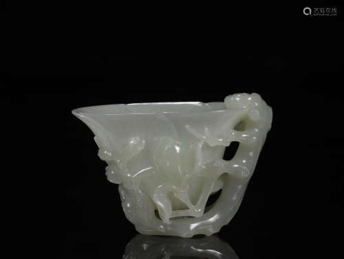 A HETIAN JADE CUP WITH ORCHID PATTERNS
