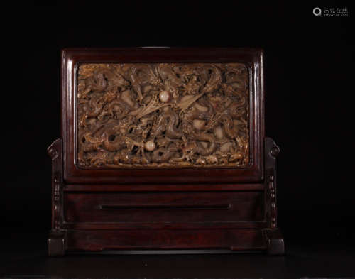 A SHOUSHAN STONE SCREEN WITHIN RED WOOD FRAME