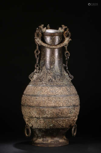 A BRONZE VASE WITH DRAGON CARVING