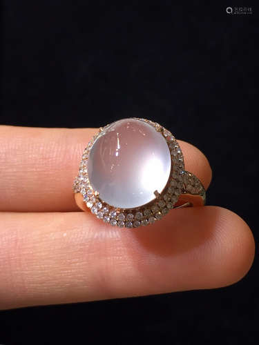 AN ICY JADEITE RING WRAPPED IN DIAMONDS