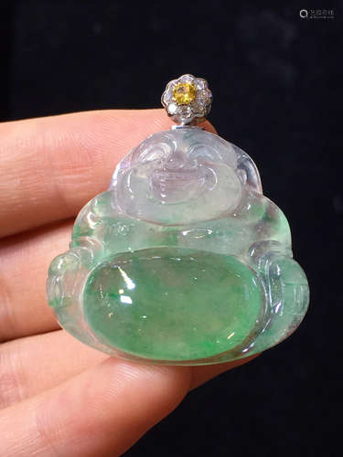 AN ICY BUDDHA SHAPED PENDANT