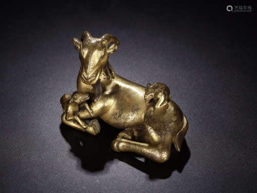 A GILT BRONZE GOAT SHAPED PAPERWEIGHT