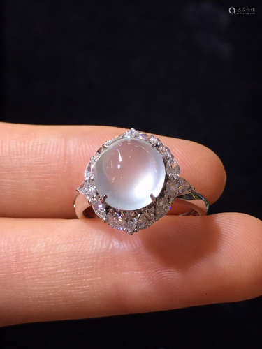 AN ICY JADEITE RING WRAPPED IN DIAMONDS