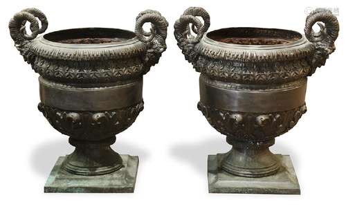 Pair of patinated bronze garden urns