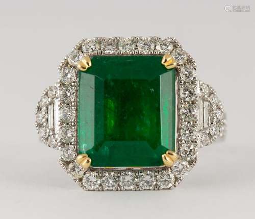 Emerald, diamond and 18k white gold ring