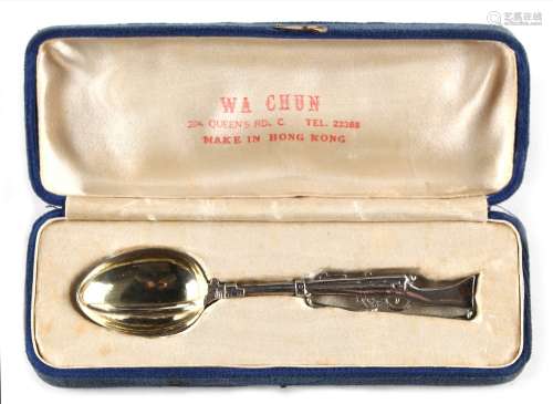 An early 20th century Chinese silver teaspoon modelled as a rifle with bayonet, makers Wa Chun, Hong