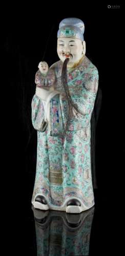 Property of a gentleman - a late 19th century Chinese famille rose figure of a mandarin holding a