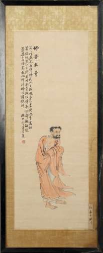 A Chinese painting on paper depicting a standing monk, early 20th century, with calligraphy & red