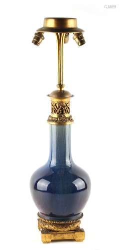 A Chinese flambe glazed bottle vase, 19th century, adapted as a table lamp with ormolu mounts, 25.