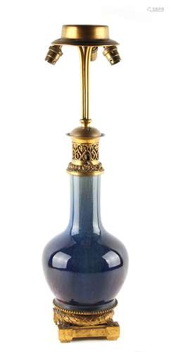 A Chinese flambe glazed bottle vase, 19th century, adapted as a table lamp with ormolu mounts, 25.