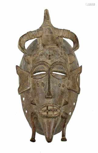 Seltene Maske kpelié des poro-Geheimbundes der Senufo, Côte d'Ivoire, aus Bronze/Gelbguss,
