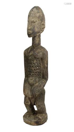 Stehende männliche Figur der Dogon, Mali, Holz geschnitzt und mit Resten von Kalkbemalung, stehend