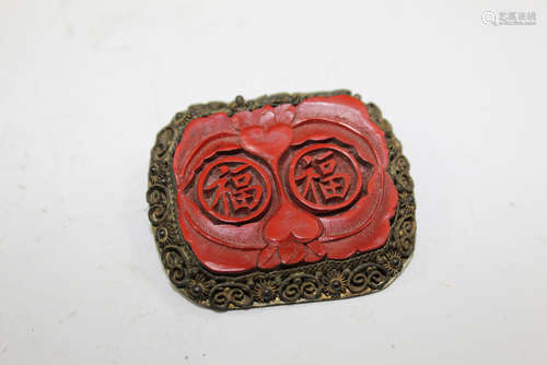 Chinese cinnabar brooch.