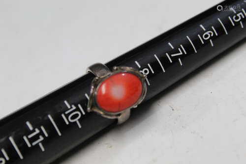 Silver and red coral ring.