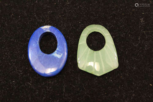 Carved jade and lapis lazuli pendants.