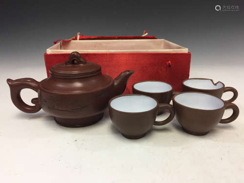Set of Chinese Yixing teapot and four cups.