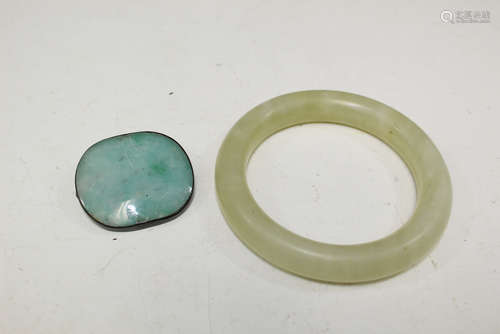 Jade bangle and brooch.