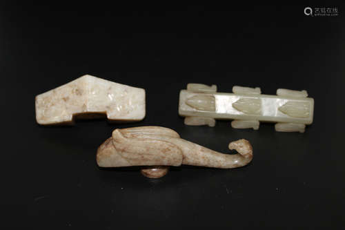 Three Chinese jade carvings.