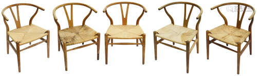 A set of five Hans Wegner (1914-2007) for Carl Hansen & Son Denmark oak CH24 wishbone dining chairs