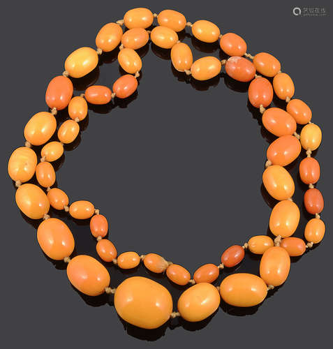 A long graduated butterscotch amber necklace