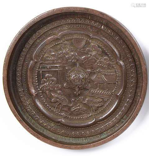 An 18th century Chinese polished bronze hand mirror