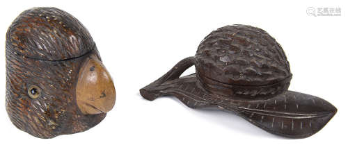 A late 19th century Swiss Black Forrest carved wood novelty inkwell in the form of a parrots head