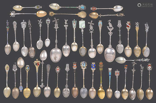 A collection of mostly early 20th century continental silver and silver gilt souvenir teaspoons